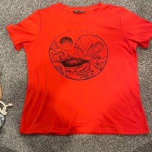 Short sleeve shirt from shein, with a black beach wave design on the front.